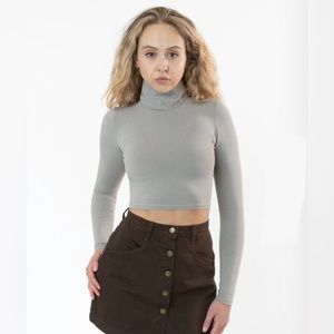 Cropped grey, tight hugging long sleeve turtle neck